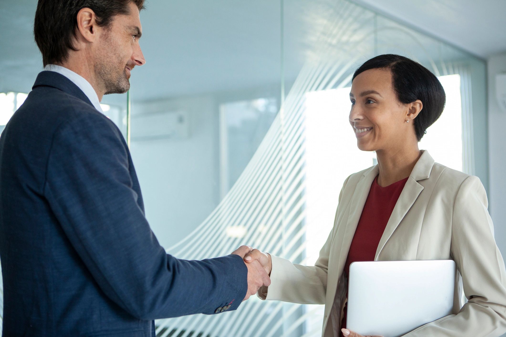 Business professionals shaking hands in an office